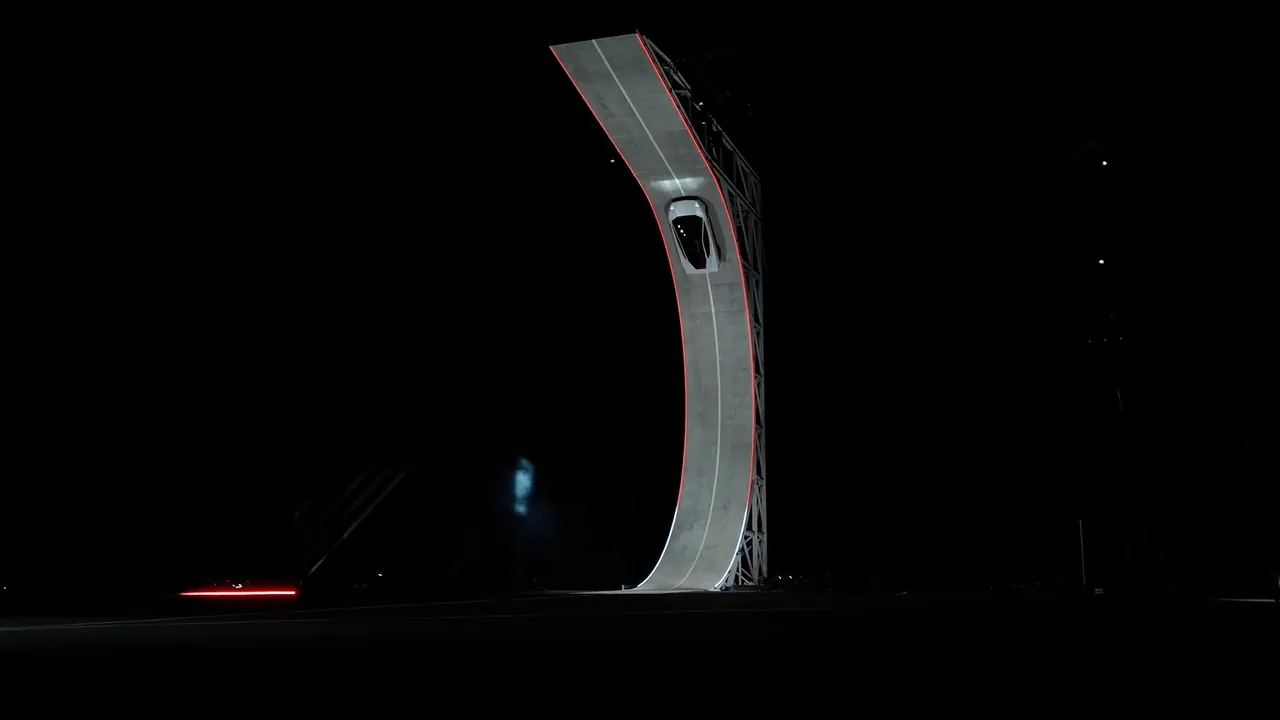 The Roadster high on the curved ramp, near the overhang where it drives upside down