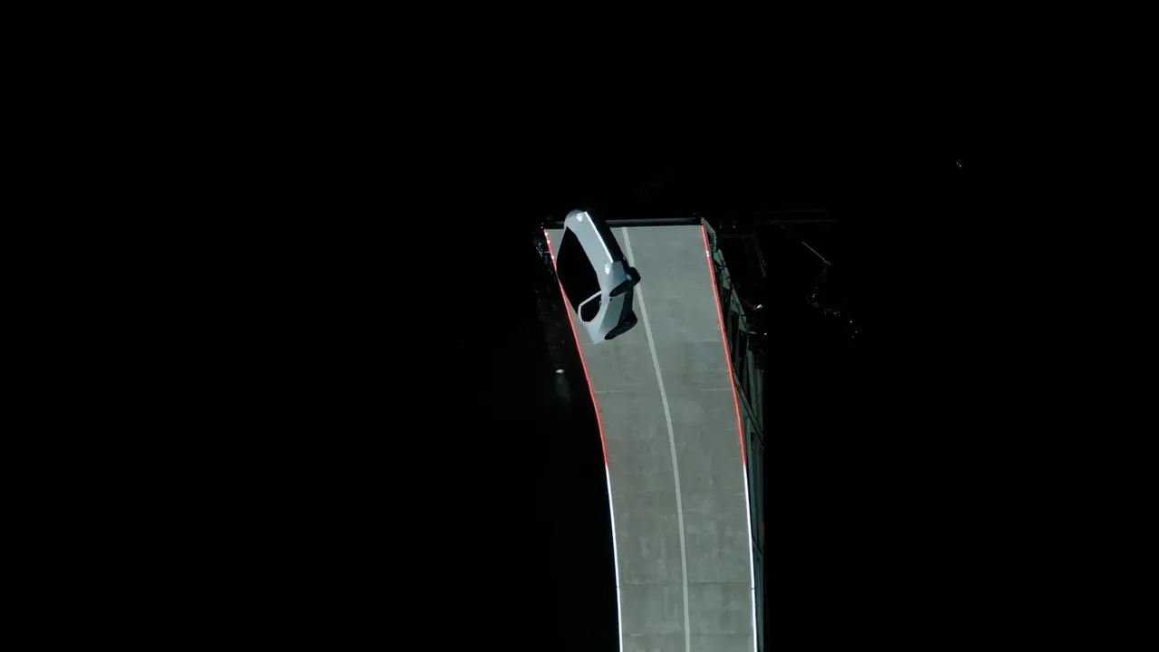 The Roadster upside down at the very top of the ramp as it lets go